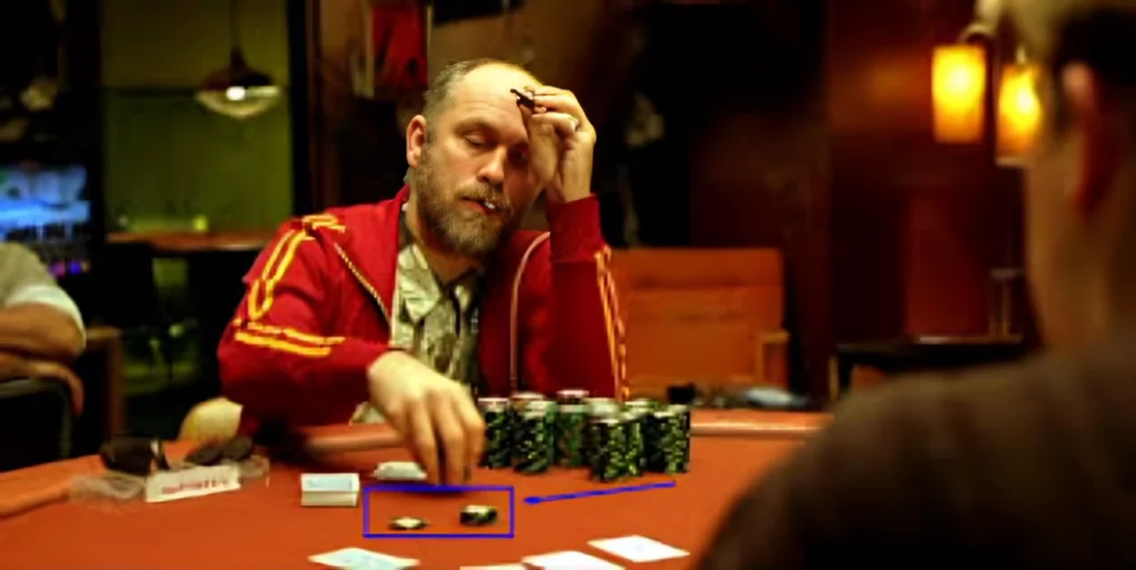 Image reflecting a famous scene from the poker movie "Rounders" where one of the players is exhibiting a strong poker tell.