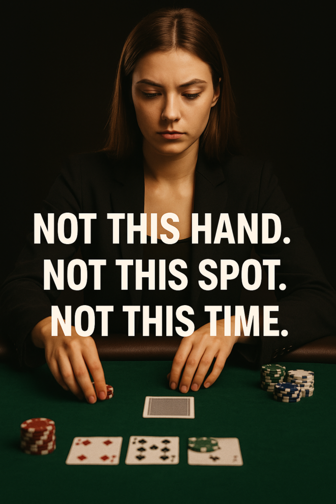 Focused young female poker player with long brown hair wearing a black blazer, seated at a green felt poker table with poker chips and community cards in front of her. Her hands rest near the center of the table beside a face-down card. Overlaid text reads: “NOT THIS HAND. NOT THIS SPOT. NOT THIS TIME.” The background is dark, creating a serious and intense atmosphere.